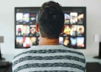 tv man watching room office