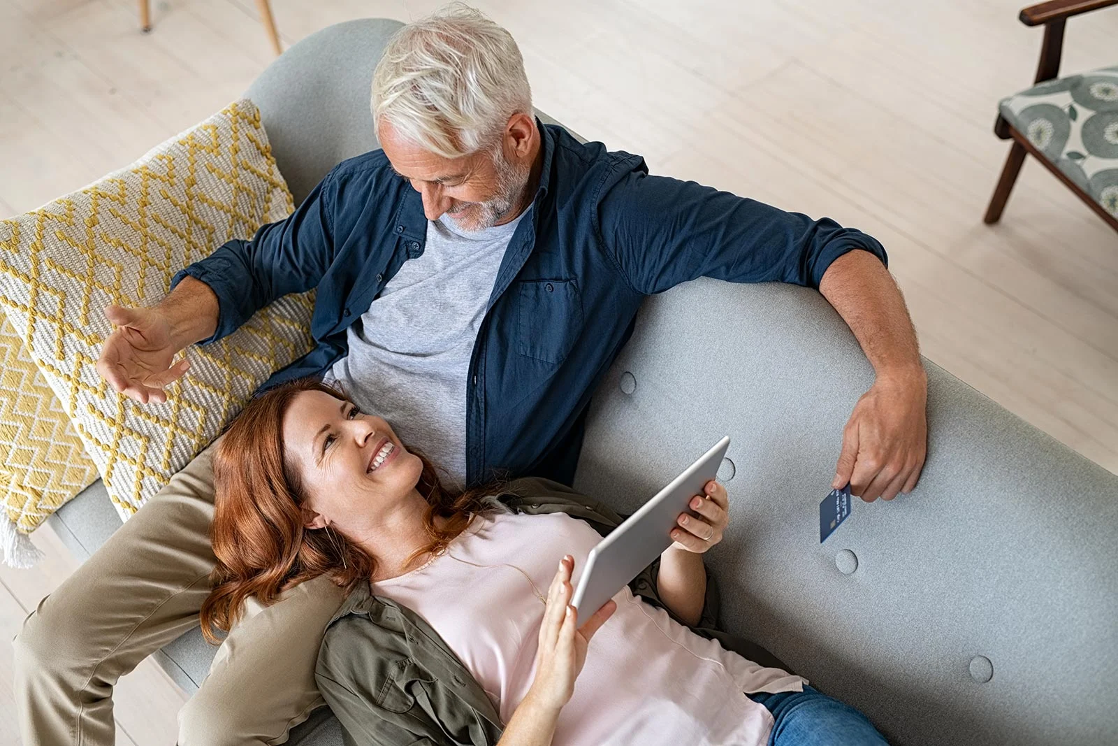 happy couple using digital tablet