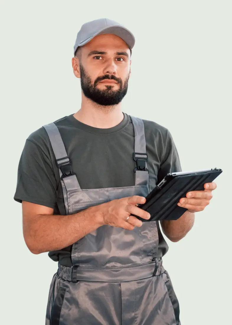 huge area male worker is in the empty warehouse
