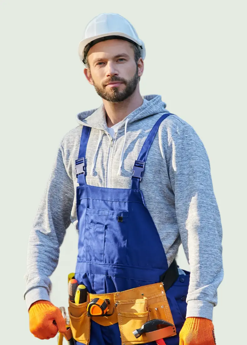 young bearded male engineer in hard hat looking