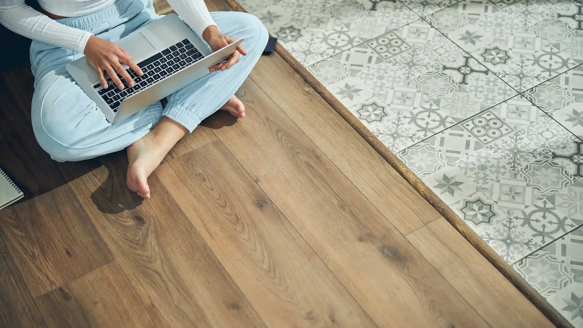 young woman working on her laptop indoors