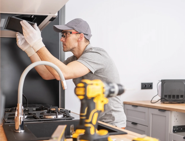 Kitchen appliance installer at work