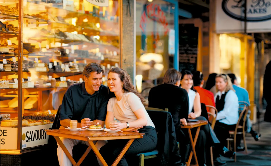 friends walking coastal road
