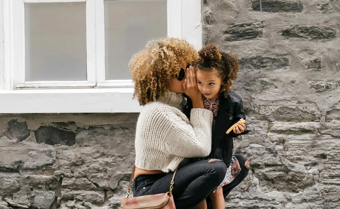 Mother hugging child