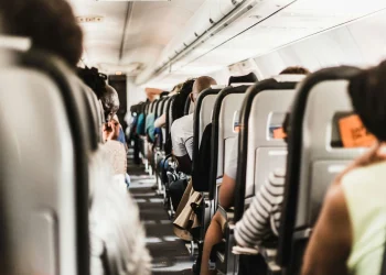Passengers seated inside airplane