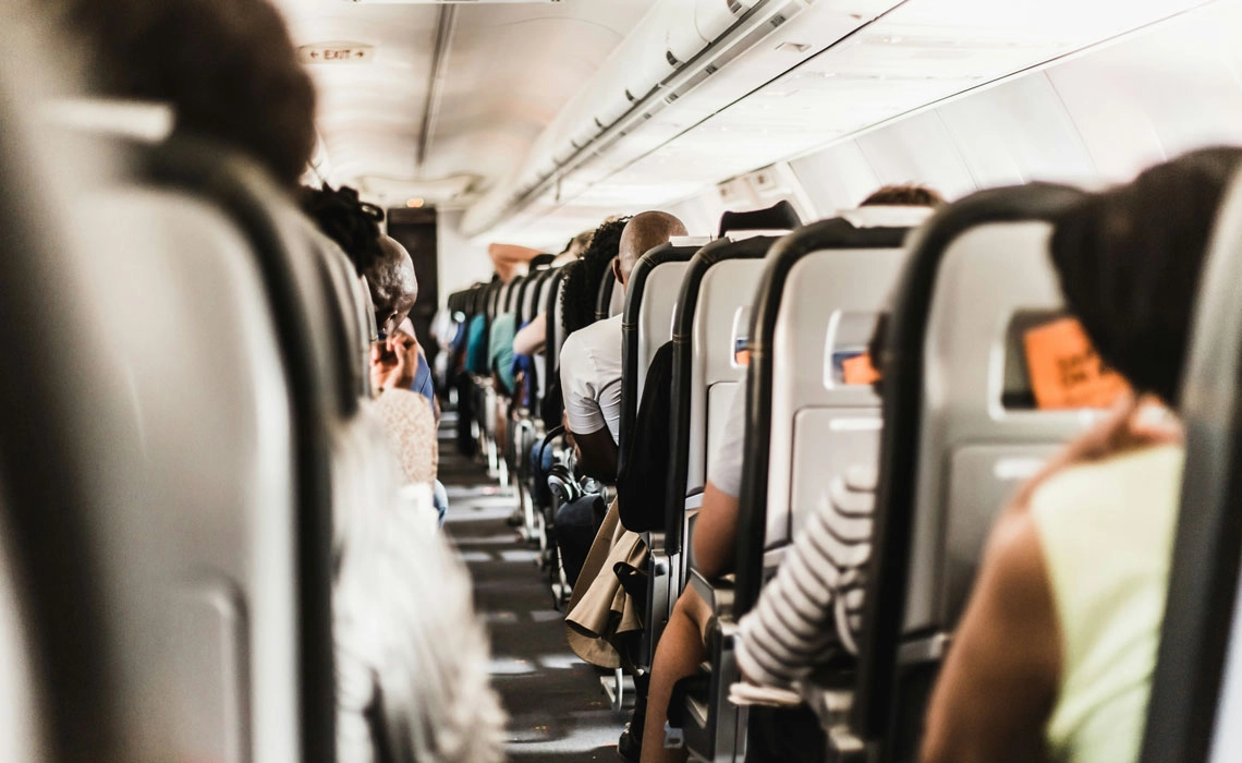 Passengers seated inside airplane