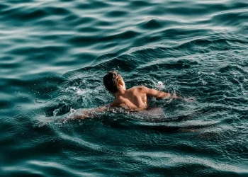 Person swimming in ocean