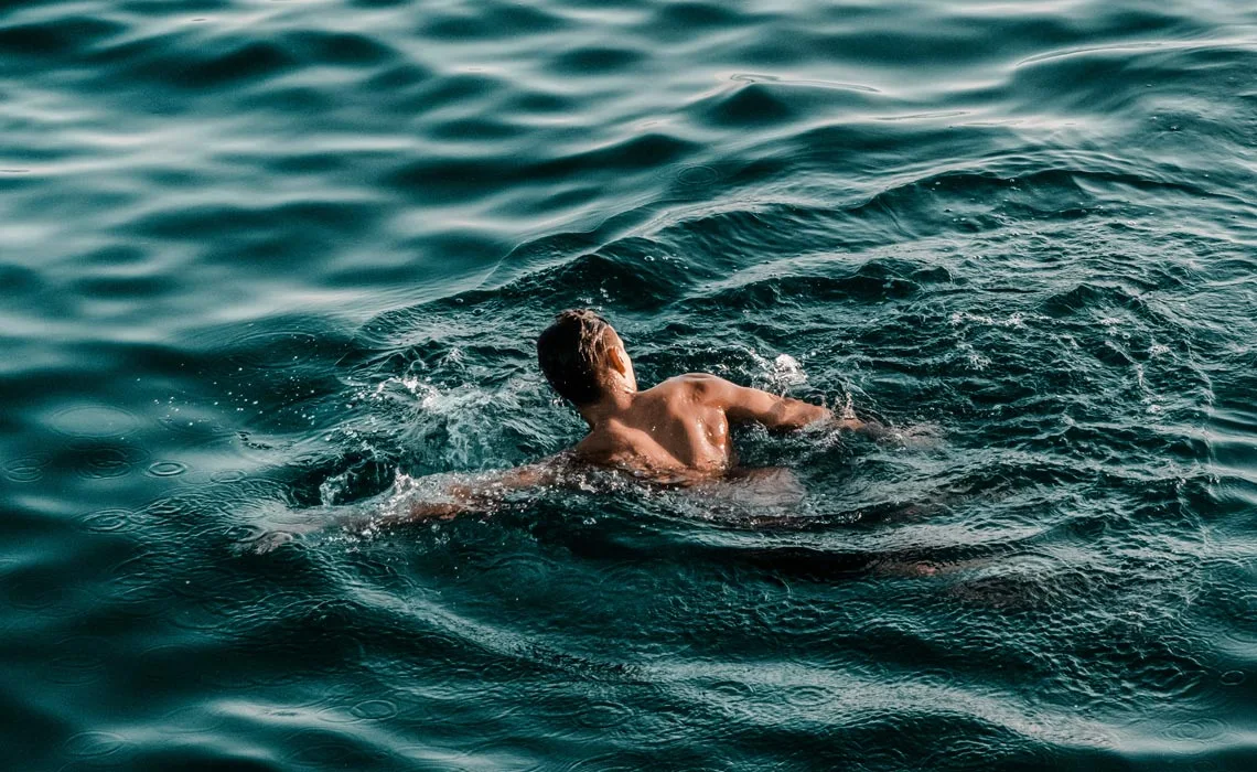 Person swimming in ocean