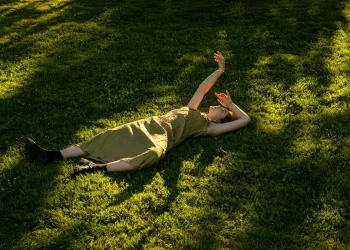 Woman lying on grass