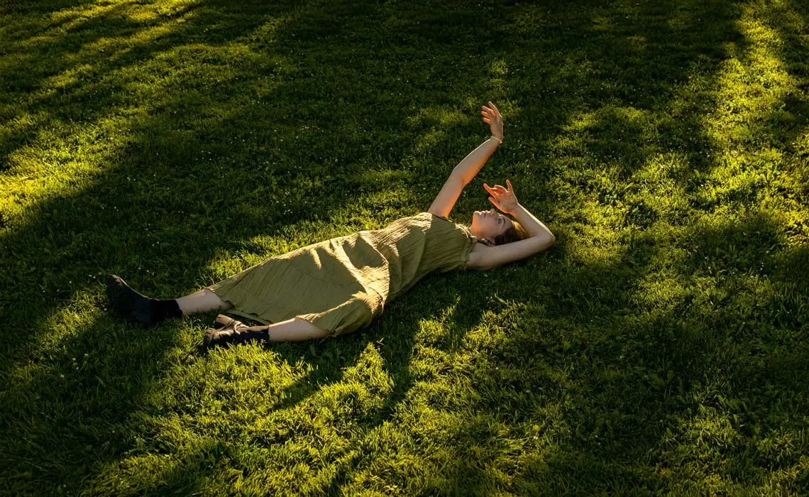 Woman lying on grass
