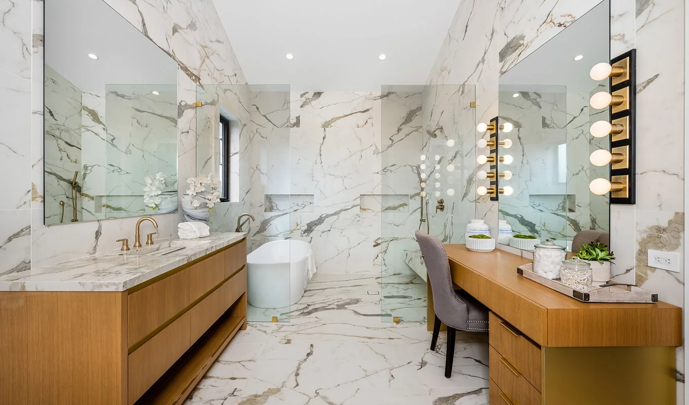 sophisticated bathroom with marble walls and double vanity