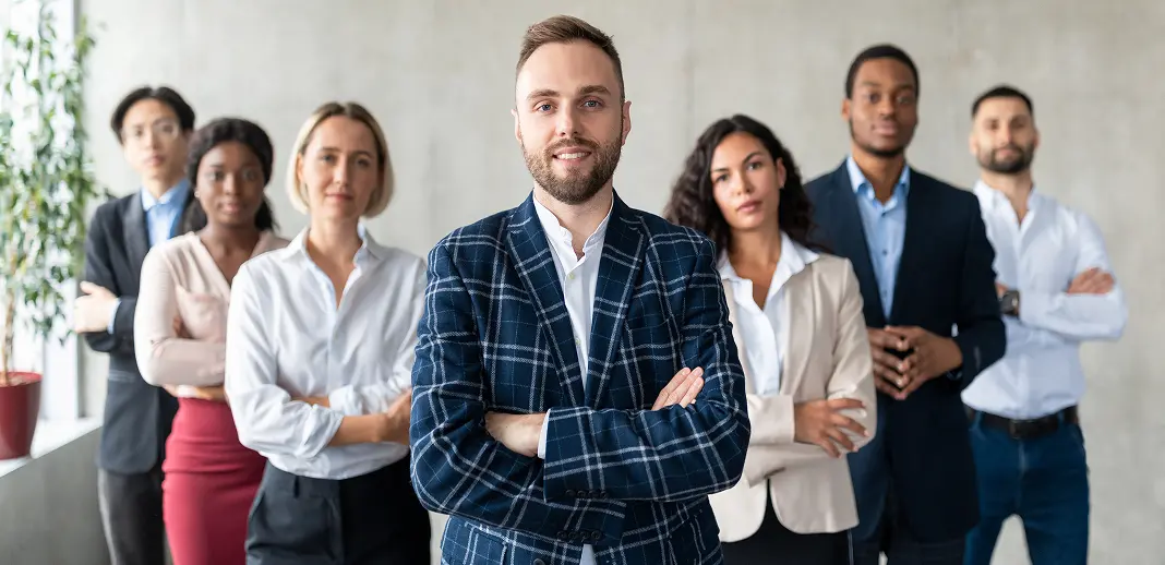 businessman-standing in front of his business team
