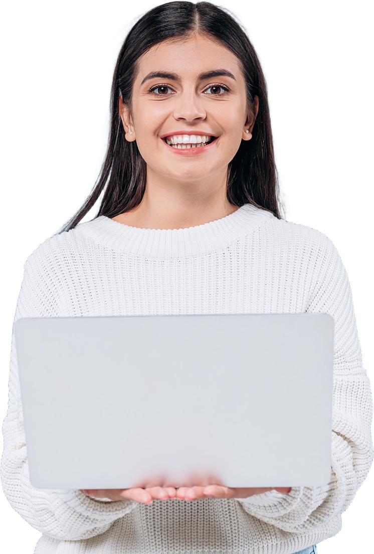 smiling pretty brunette girl in white sweater holding laptop isolated