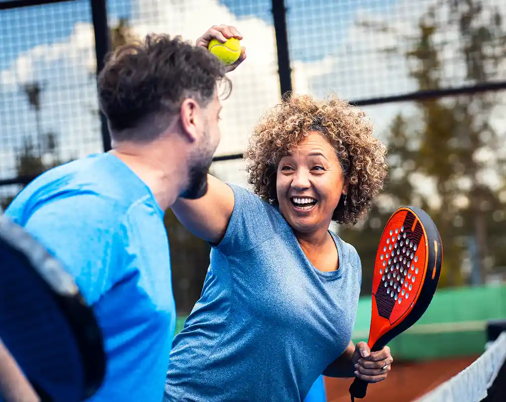 mixed adult couple celebrate winning the point
