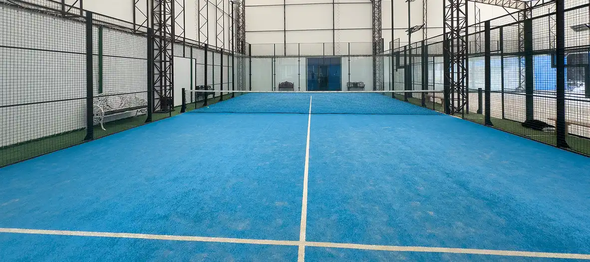 padel court with lines and net indoor