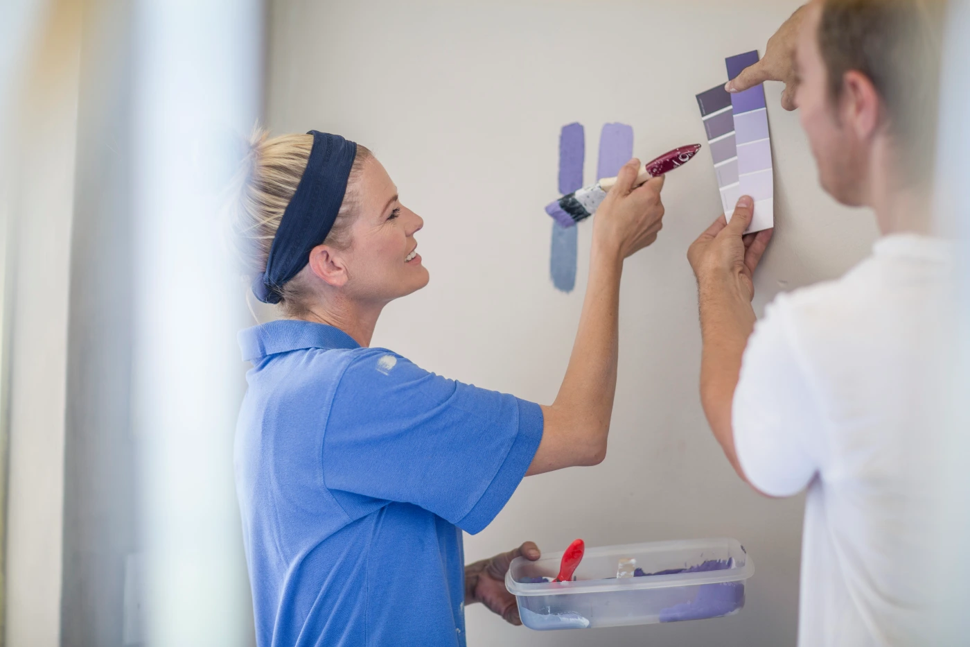 Couple comparing paint swatches