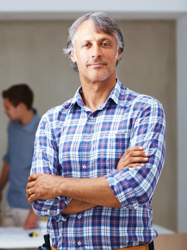 Confident male contractor with flannel shirt