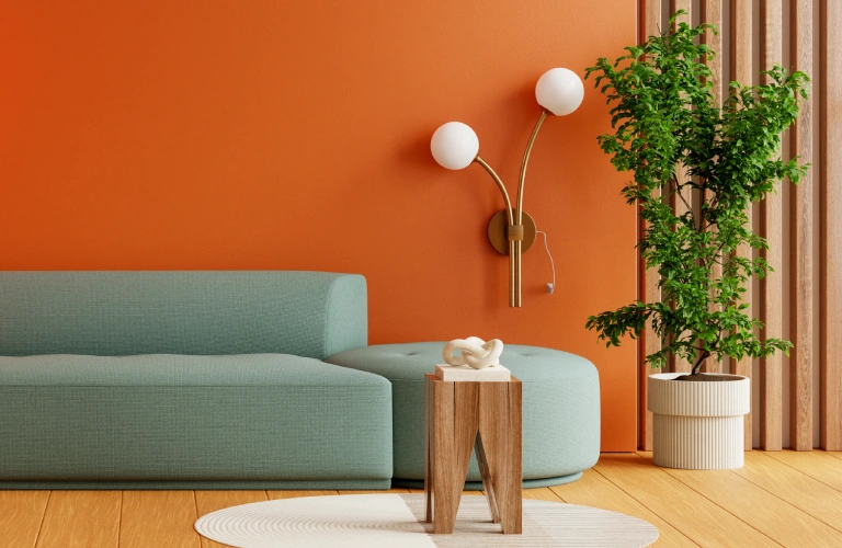 Modern cozy reading corner with orange wall