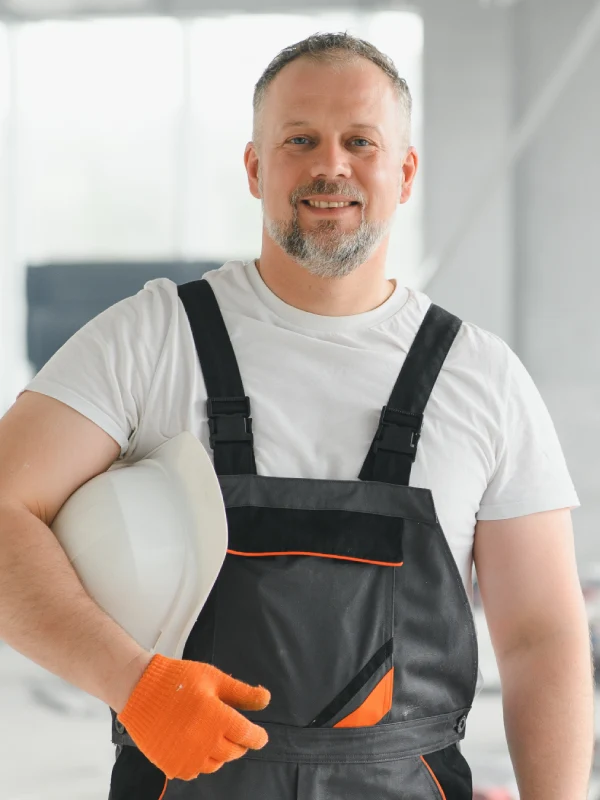 Portrait of a builder in working uniform