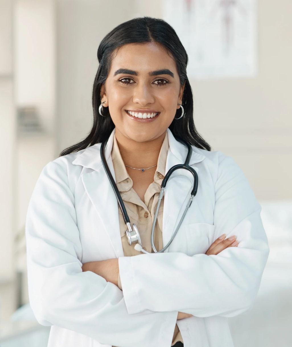 female doctor smiling pose on white lab coat