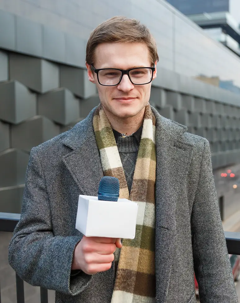 a happy reporter leads a report on the camera