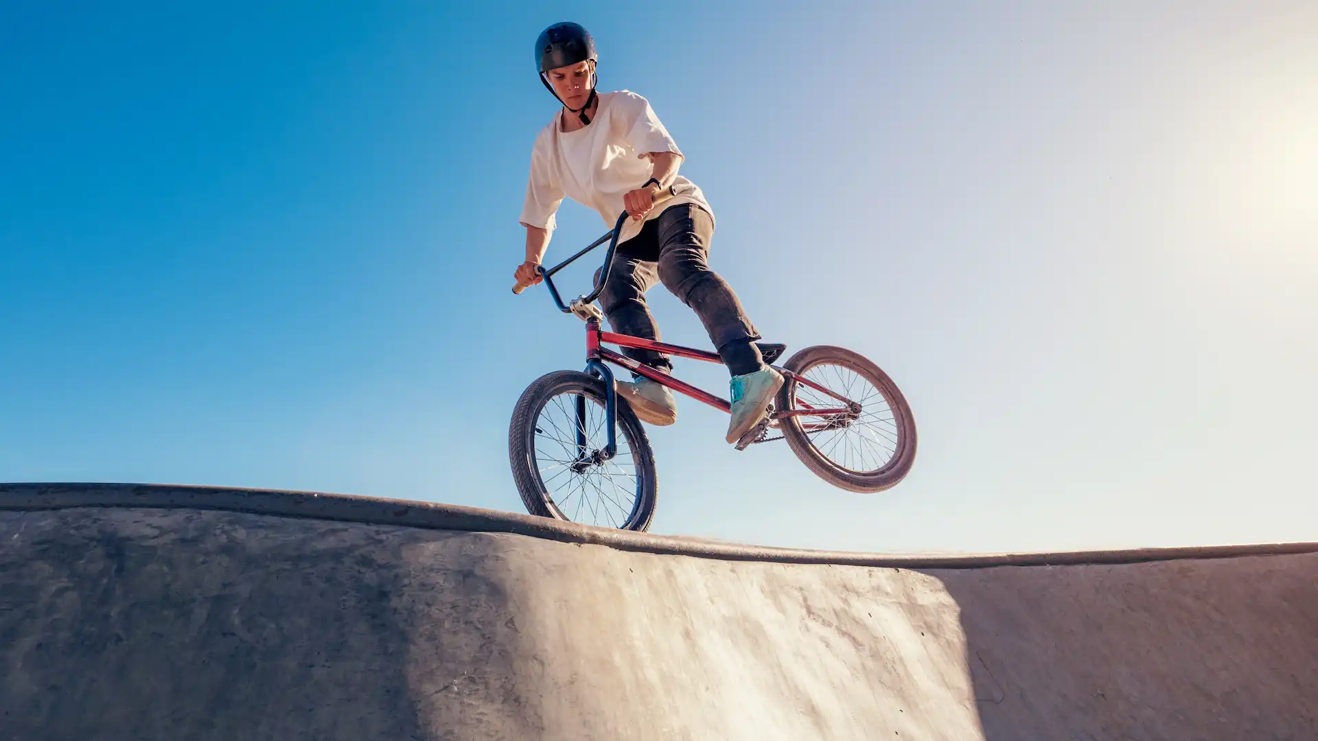 bmx bicycle rider performing footjam trick