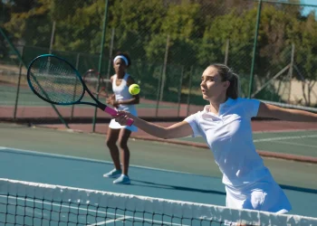 caucasian female athlete playing tennis