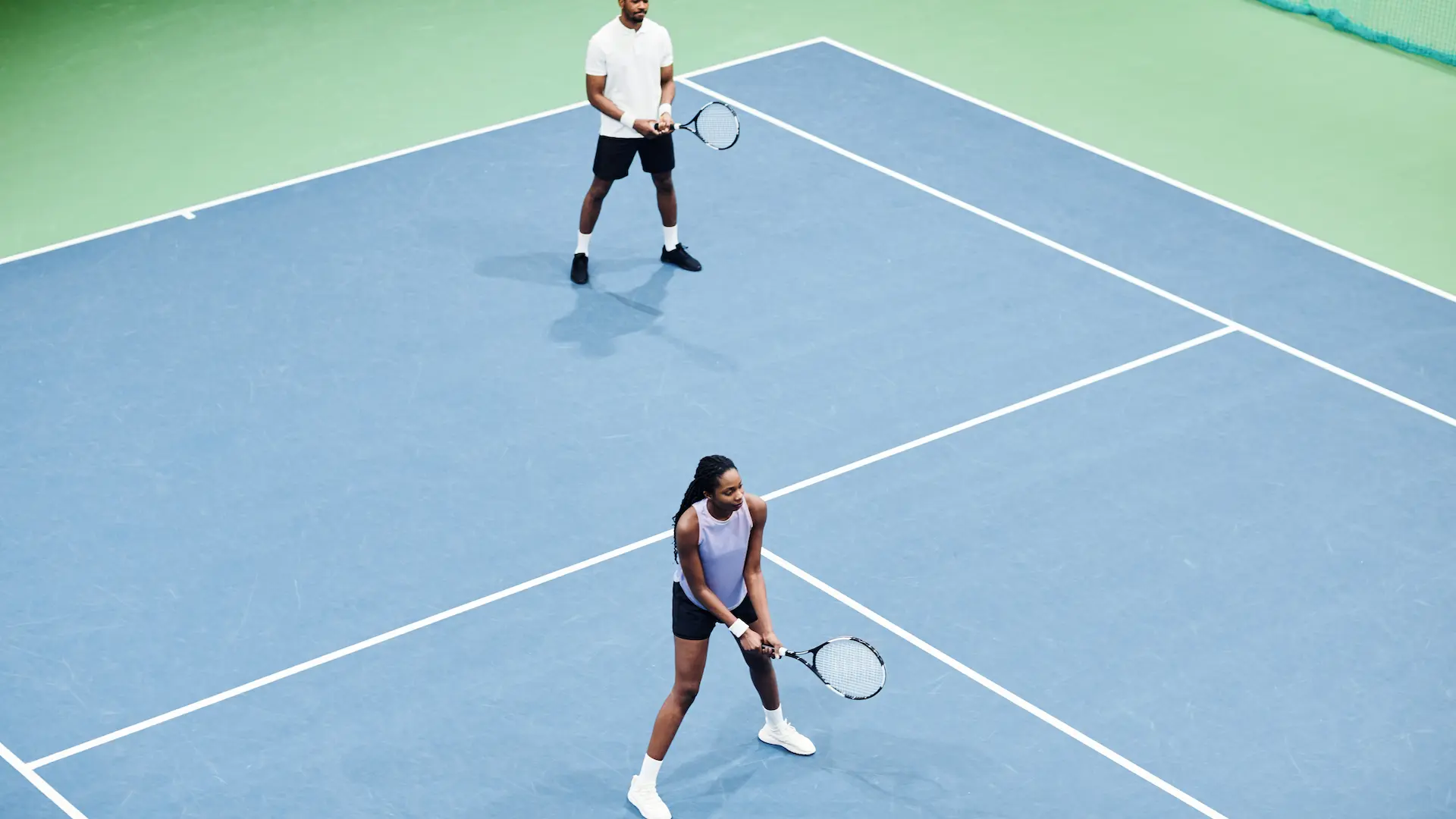 couple at tennis practice minimal