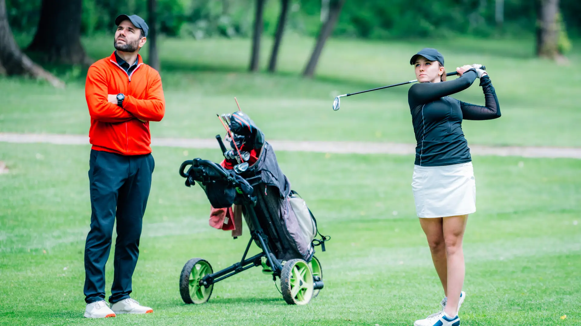 golf training two young ladies with golf