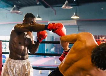 gym atmosphere two professional fighters posing