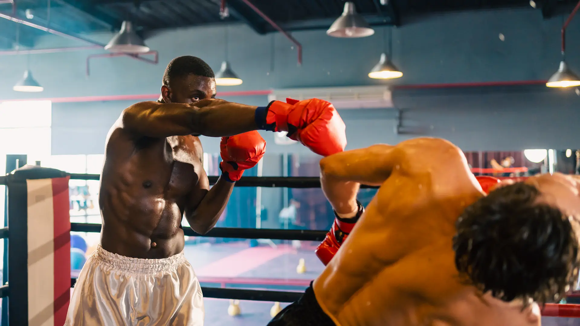 gym atmosphere two professional fighters posing