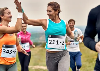 happy marathon runners giving high five