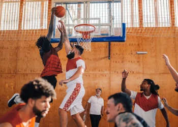 interracial basketball player dunking the ball