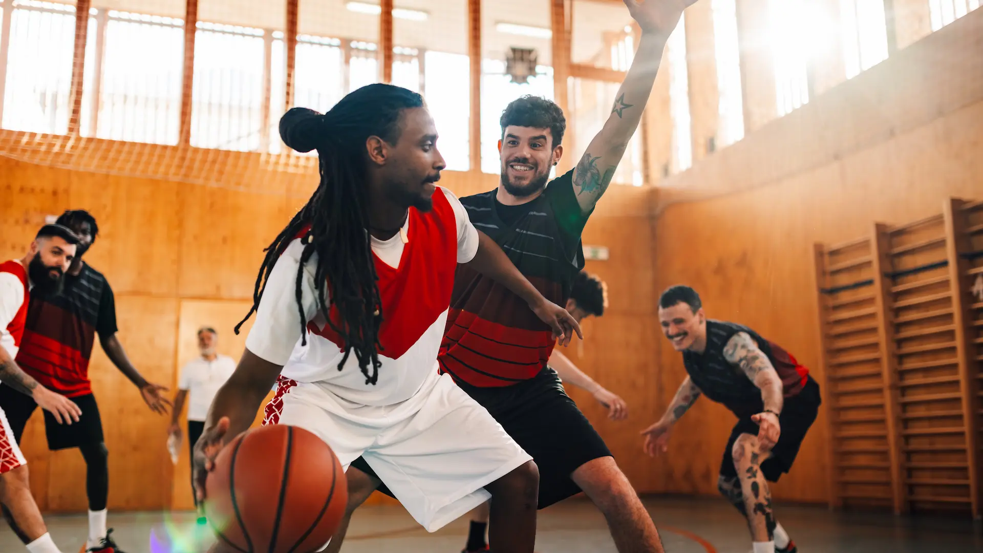 multicultural basketball players playing basketbal