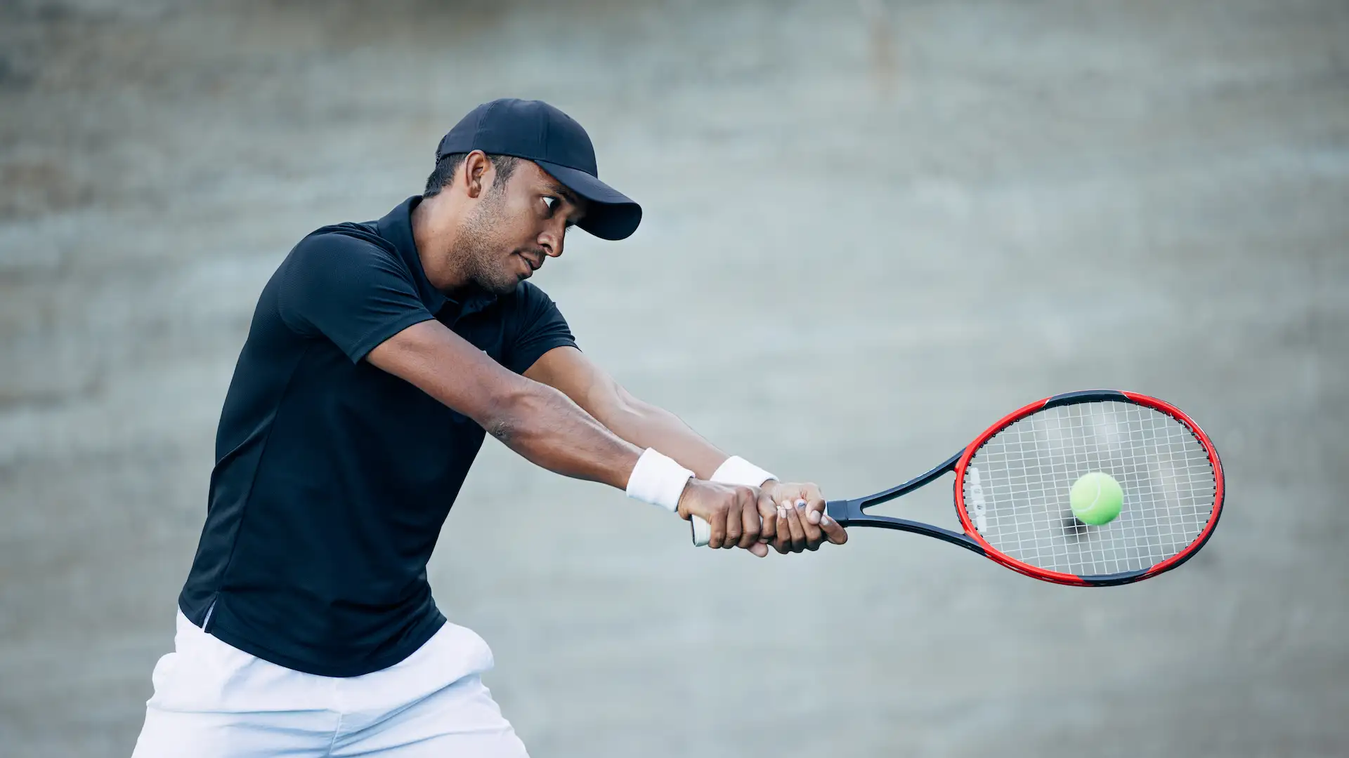 professional tennis player hitting ball