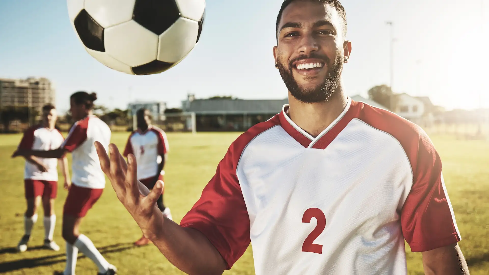 real soccer team training on field and men