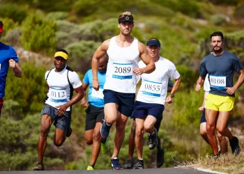 setting the pace shot of a group of young men run