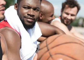 side view of multicultural basketball team