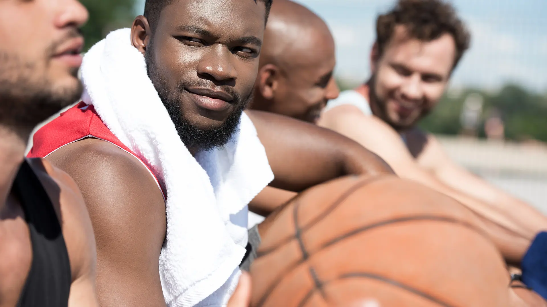 side view of multicultural basketball team