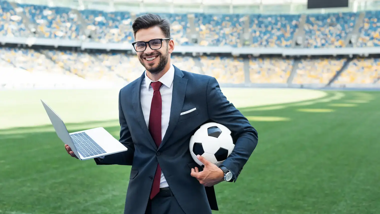 smiling young businessman in suit
