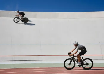 two healthy man cyclists exercising on bicycles