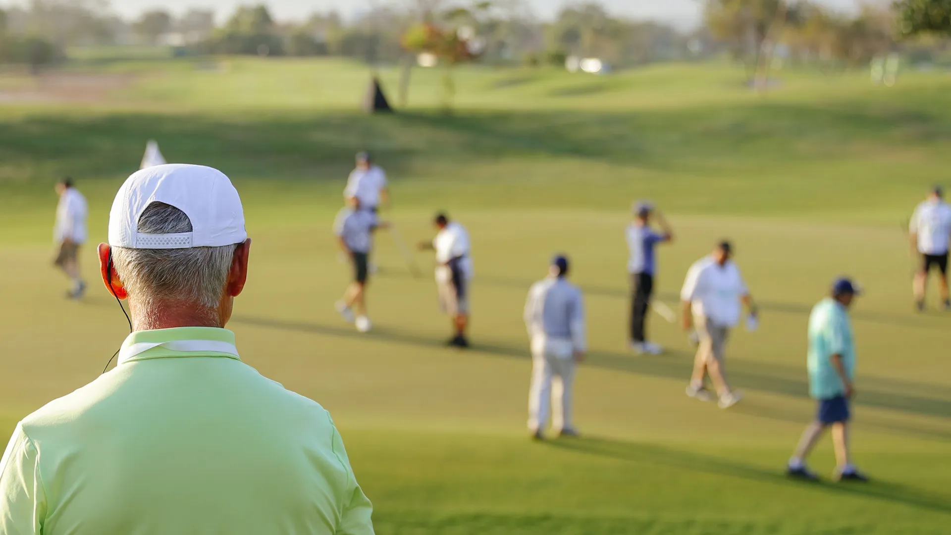 view from behind of a golf honorary observer
