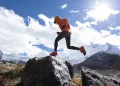 woman trail runner cross country running in high