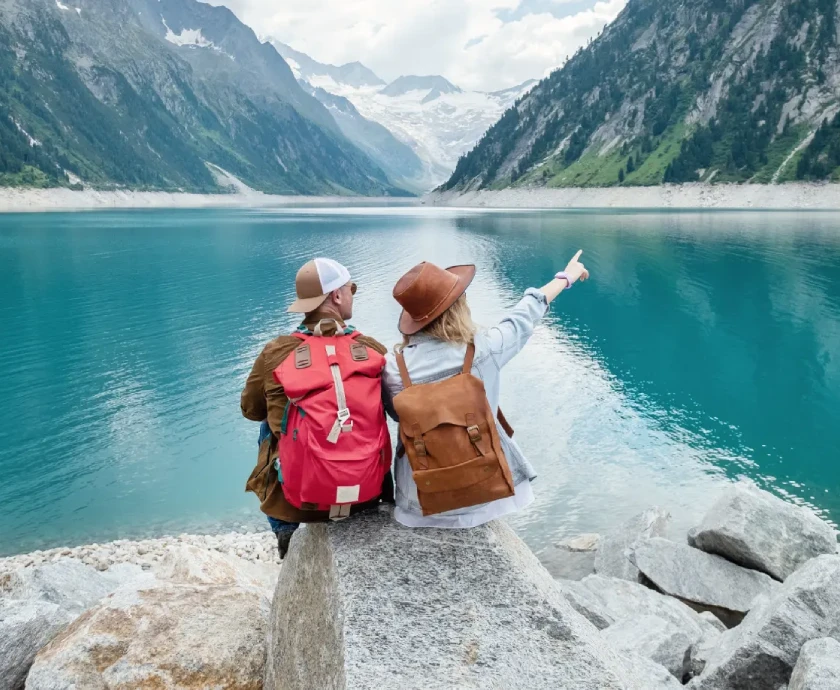 a team of travelers looking at the lake in austria