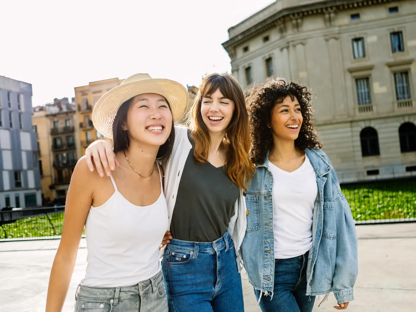 Diverse group of three happy young women having