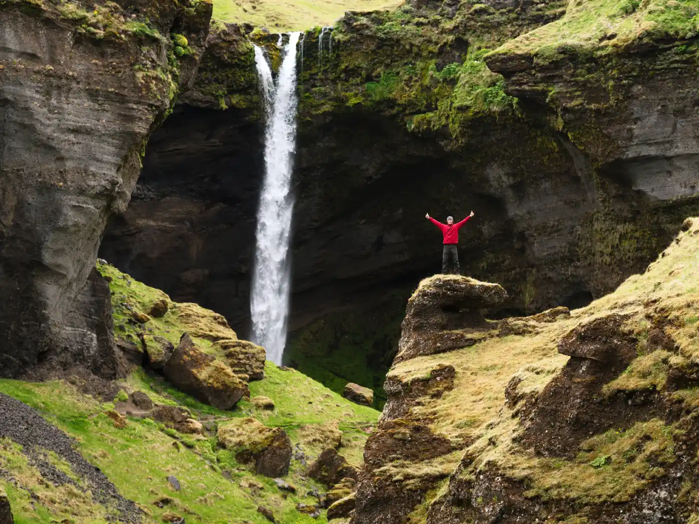 Man travel take photo with background waterfall in iceland