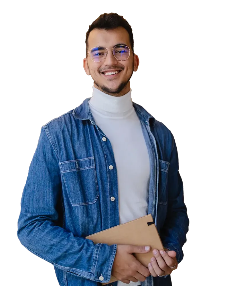 young businessman smiling and holding a notebook
